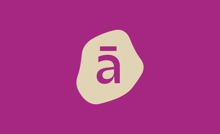 A beige, irregular blob shape with a lowercase letter a topped by a macron (horizontal line) in purple, centered on a solid magenta background.