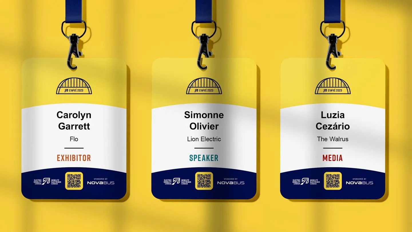 Three yellow conference badges hang against a yellow background. They display names, companies, and roles: Exhibitor (orange), Speaker (green), and Media (red), each with a black lanyard and an event logo at the top.