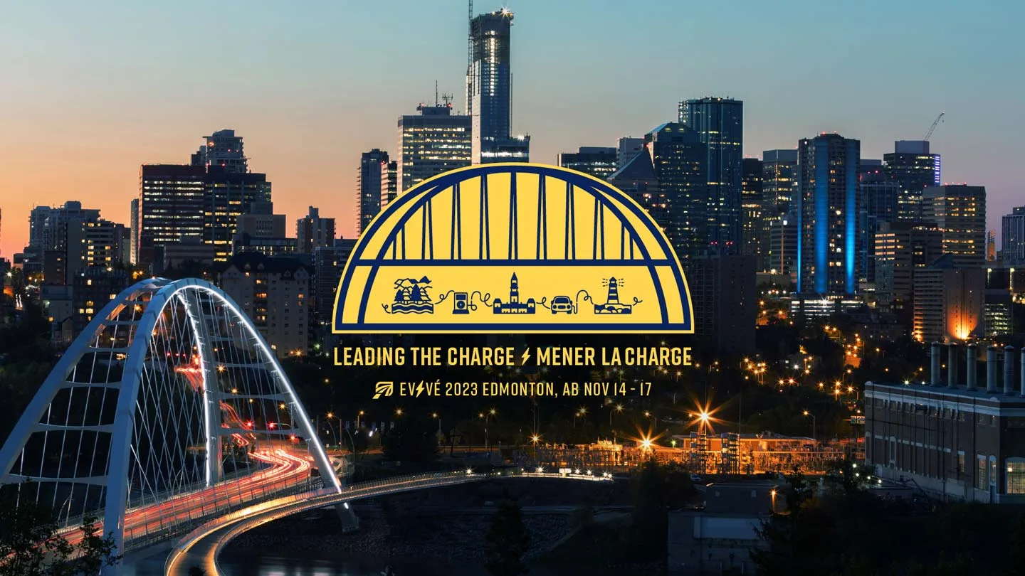 A city skyline at dusk with a lit bridge in the foreground. Overlaid is a yellow logo featuring transportation icons and text: Leading the Charge / Mener la Charge. EVVE 2023 Edmonton, AB Nov 14–17.